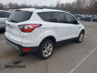 2018 Ford Escape SE z VIN 1FMCU9GD2JUC77186, wystawiony jako IAAI lot #41308133 z przebiegiem 123 156 mil mil oraz . Historia ofert i sprzedaży dostępna na DreamBid. Obrazek 4.