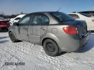 2011 Kia Rio with VIN KNADH4B32B6915325, listed as a Copart auction lot 86824074 with 167,410 mi miles and Salvage Title. Bid and sale history available at DreamBid. Image 2.