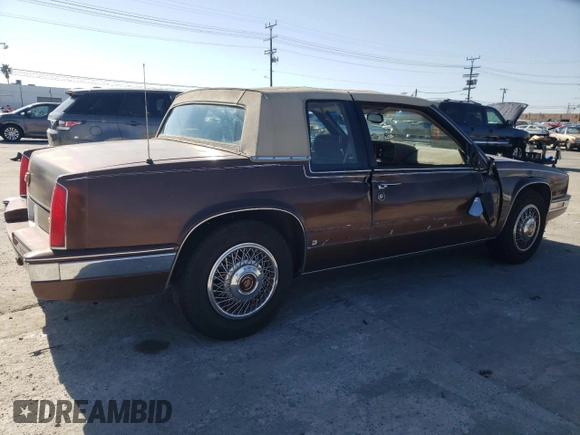 1988 Cadillac Eldorado z VIN 1G6EL115XJU611177, wystawiony jako Copart lot #46526855 z przebiegiem 122 780 mil mil oraz Szkoda całkowita • Salvage title. Historia ofert i sprzedaży dostępna na DreamBid. Obrazek 3.