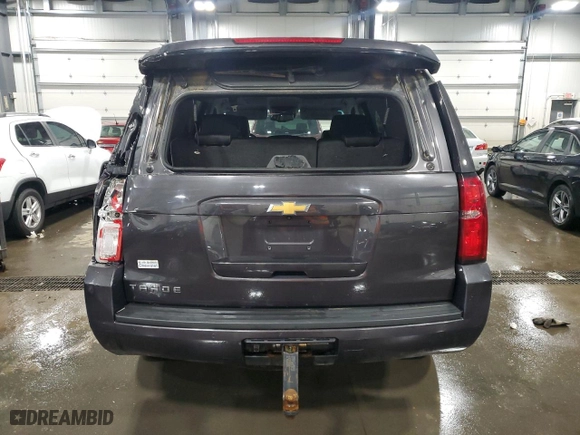 2015 Chevrolet Tahoe LT with VIN 1GNSKBKCXFR126500, listed as a Copart auction lot 49814255 with 106,714 mi miles and Salvage Title. Bid and sale history available at carsss.com. Image 6.