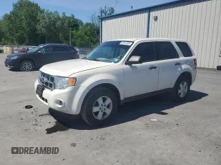 2010 Ford Escape XLS with VIN 1FMCU9C77AKB93098, listed as a Copart auction lot 62512435 with 118,443 mi miles and Salvage title. Bid and sale history available at DreamBid. Image 1.