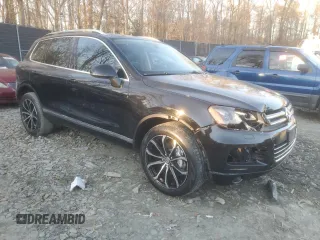 2013 Volkswagen Touareg Lux with VIN WVGEF9BP1DD001025, listed as a Copart auction lot 83784314 with 205,871 mi miles and Salvage Title. Bid and sale history available at DreamBid. Image 4.