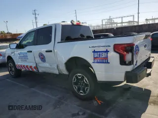 2023 Ford F-150 Lightning Pro с VIN 1FTVW1EL2PWG13712, выставлен на аукционе Copart как лот 56950955 с пробегом 60 605 миль миль и Списание • Salvage title. История ставок и продаж доступна на DreamBid. Изображение 2.