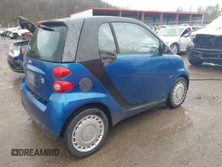 2009 Smart fortwo Pure with VIN WMEEJ31X69K312553, listed as a IAAI auction lot 41957660 with 156,476 mi miles. Bid and sale history available at carsss.com. Image 4.