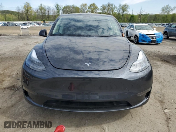 2025 Tesla Model Y Long Range with VIN 7SAYGDED7SF320702, listed as a Copart auction lot 54655325 with 1,169 mi miles and Salvage Title. Bid and sale history available at DreamBid. Image 5.