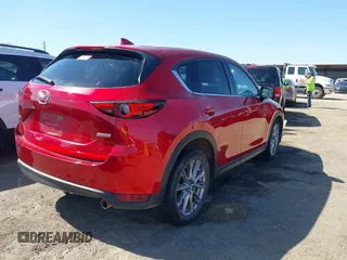 2019 Mazda CX-5 Grand Touring with VIN JM3KFADM5K1556917, listed as a IAAI auction lot 41706323 with 77,804 mi miles. Bid and sale history available at carsss.com. Image 4.