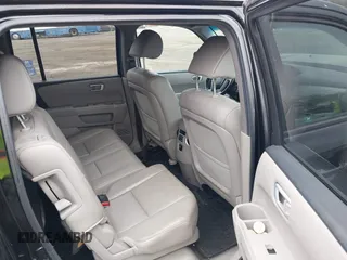 2012 Honda Pilot EX-L with VIN 5FNYF4H57CB068021, listed as a IAAI auction lot 41909996 with 253,542 mi miles and . Bid and sale history available at carsss.com. Image 8.