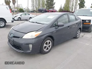 2013 Toyota Prius One with VIN JTDKN3DU6D5599875, listed as a IAAI auction lot 42057892 with 118,216 mi miles. Bid and sale history available at carsss.com. Image 2.