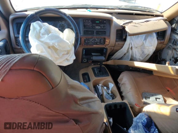 1998 Jeep Grand Cherokee with VIN 1J4GX48Y7WC216585, listed as a Copart auction lot 83532184 with 144,739 mi miles and Salvage title. Bid and sale history available at DreamBid. Image 8.