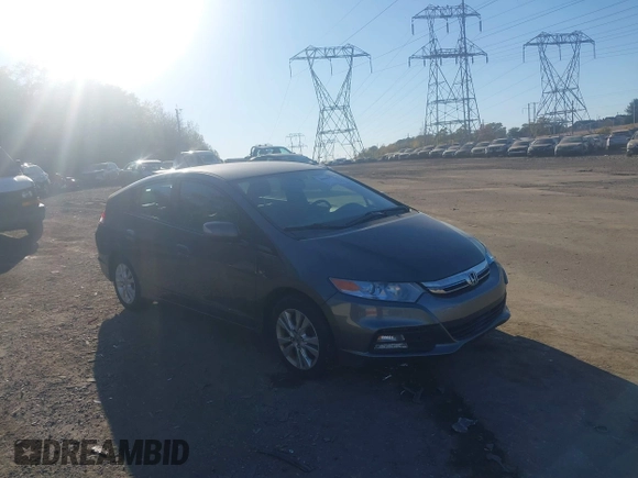 2012 Honda Insight EX z VIN JHMZE2H70CS004787, wystawiony jako IAAI lot #40668475 z przebiegiem 127 599 mil mil oraz . Historia ofert i sprzedaży dostępna na DreamBid. Obrazek 1.
