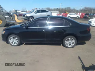 2016 Volkswagen Jetta Sedan 1.4T SE with VIN 3VWD67AJXGM242539, listed as a IAAI auction lot 38948493 with 121,876 mi miles. Bid and sale history available at carsss.com. Image 14.