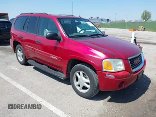 2005 GMC Envoy SLT with VIN 1GKDS13SX52144959, listed as a IAAI auction lot 41968495 with 238,199 mi miles. Bid and sale history available at carsss.com. Image 1.