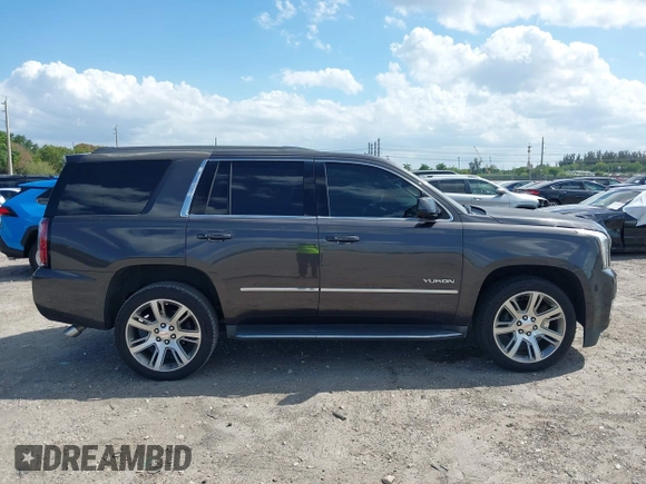 2016 GMC Yukon SLT with VIN 1GKS2BKC2GR277460, listed as a IAAI auction lot 42027026 with 111,191 mi miles. Bid and sale history available at carsss.com. Image 14.