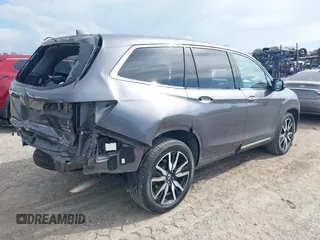 2022 Honda Pilot Elite with VIN 5FNYF6H04NB025212, listed as a IAAI auction lot 42430032 with 69,427 mi miles and . Bid and sale history available at DreamBid. Image 4.