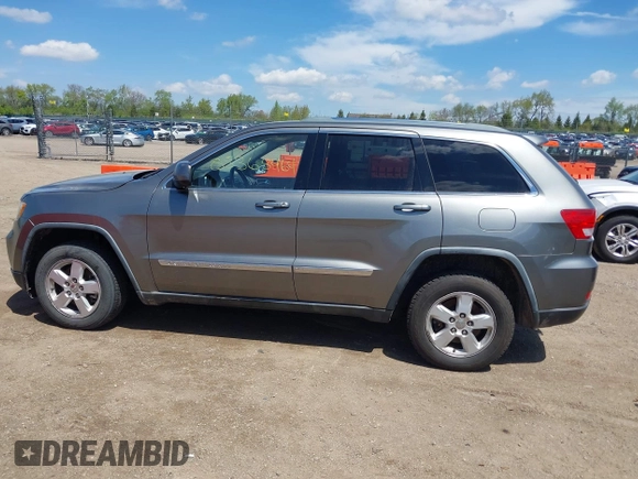 2011 Jeep Grand Cherokee Laredo with VIN 1J4RR4GGXBC587911, listed as a IAAI auction lot 42156885 with 178,999 mi miles and . Bid and sale history available at DreamBid. Image 14.