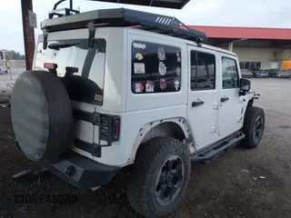 2014 Jeep Wrangler Unlimited Sahara with VIN 1C4BJWEG7EL204489, listed as a IAAI auction lot 41255239 with 68,803 mi miles and . Bid and sale history available at DreamBid. Image 4.