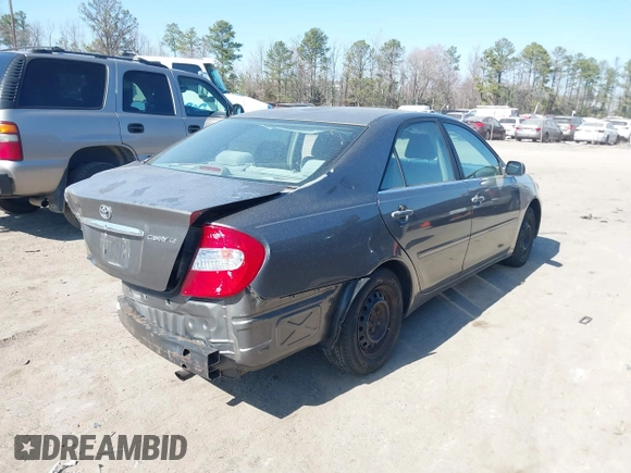 2003 Toyota Camry LE with VIN 4T1BE32K63U659008, listed as a IAAI auction lot 41790929 with 206,878 mi miles and . Bid and sale history available at DreamBid. Image 4.
