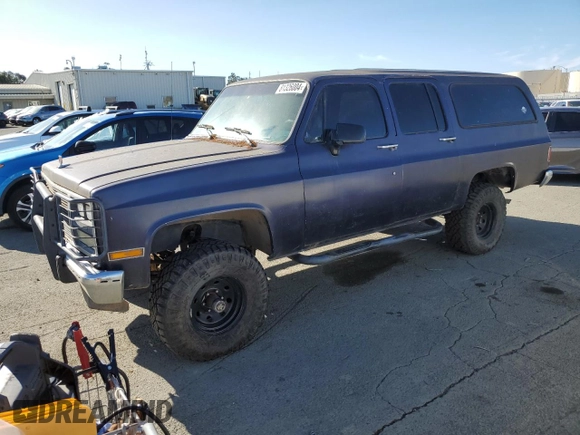 1991 GMC Suburban z VIN 1GKEV16K9MF510909, wystawiony jako Copart lot #81326004 z przebiegiem 216 778 mil mil oraz Tytuł czysty. Historia ofert i sprzedaży dostępna na DreamBid. Obrazek 1.