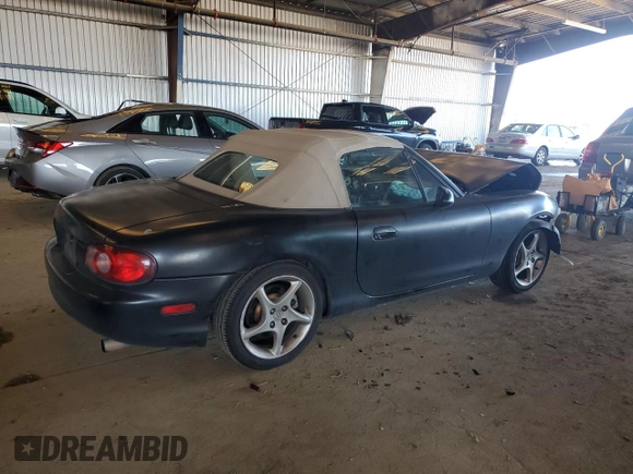 2003 Mazda MX-5 Miata Cloth with VIN JM1NB353730303334, listed as a Copart auction lot 51692615 with 142,789 mi miles and Salvage title. Bid and sale history available at DreamBid. Image 3.