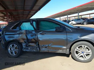 2015 Ford Edge Titanium z VIN 2FMTK3K90FBC12582, wystawiony jako IAAI lot #41860973 z przebiegiem Nie podano mil oraz . Historia ofert i sprzedaży dostępna na DreamBid. Obrazek 12.