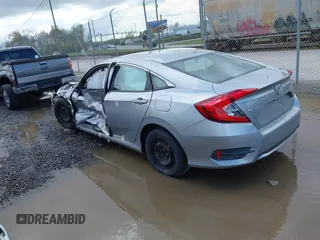 2019 Honda Civic LX with VIN 19XFC2F61KE009471, listed as a IAAI auction lot 42017532 with 81,134 mi miles and . Bid and sale history available at DreamBid. Image 3.
