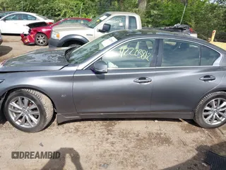 2015 Infiniti Q50 Premium z VIN JN1BV7AR1FM398047, wystawiony jako IAAI lot #42203862 z przebiegiem 104 002 mil mil oraz . Historia ofert i sprzedaży dostępna na DreamBid. Obrazek 14.