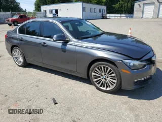2015 BMW 3 Series 328i xDrive with VIN WBA3B3C5XFJ985147, listed as a Copart auction lot 59819905 with 113,492 mi miles and Salvage title. Bid and sale history available at DreamBid. Image 4.