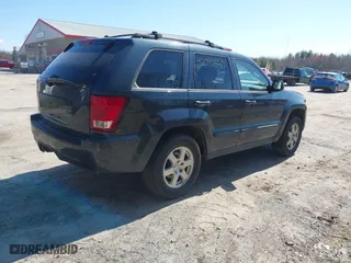2008 Jeep Grand Cherokee Laredo with VIN 1J8GR48K98C161239, listed as a IAAI auction lot 42090850 with 218,063 mi miles. Bid and sale history available at carsss.com. Image 4.
