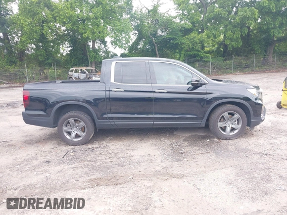 2023 Honda Ridgeline RTL-E with VIN 5FPYK3F77PB052828, listed as a IAAI auction lot 42366947 with 24,658 mi miles and . Bid and sale history available at DreamBid. Image 13.