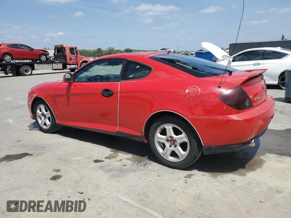 2003 Hyundai Tiburon GT z VIN KMHHN65F33U088538, wystawiony jako Copart lot #54320955 z przebiegiem 220 732 mil mil oraz Szkoda całkowita • Salvage title. Historia ofert i sprzedaży dostępna na DreamBid. Obrazek 2.