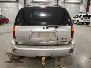 2007 GMC Envoy SLE z VIN 1GKDT13S172300399, wystawiony jako Copart lot #56978495 z przebiegiem 239 862 mil mil oraz Nie do naprawy. Historia ofert i sprzedaży dostępna na DreamBid. Obrazek 6.