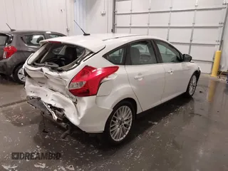 2014 Ford Focus Titanium with VIN 1FADP3N27EL110287, listed as a IAAI auction lot 42210697 with 107,741 mi miles and . Bid and sale history available at DreamBid. Image 4.