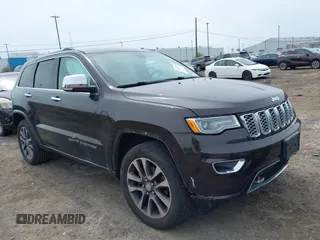 2017 Jeep Grand Cherokee Overland z VIN 1C4RJFCG8HC805352, wystawiony jako IAAI lot #42347418 z przebiegiem 137 000 mil mil oraz . Historia ofert i sprzedaży dostępna na DreamBid. Obrazek 1.