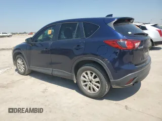2014 Mazda CX-5 Touring z VIN JM3KE2CYXE0327950, wystawiony jako Copart lot #51390585 z przebiegiem 129 523 mil mil oraz Czysty tytuł • Clean title. Historia ofert i sprzedaży dostępna na DreamBid. Obrazek 2.