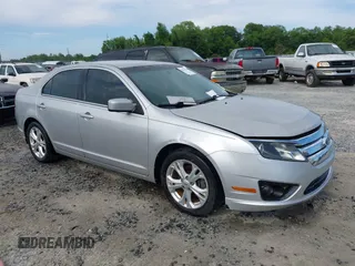 2012 Ford Fusion SE z VIN 3FAHP0HA7CR292042, wystawiony jako IAAI lot #42199454 z przebiegiem 202 058 mil mil oraz . Historia ofert i sprzedaży dostępna na DreamBid. Obrazek 1.