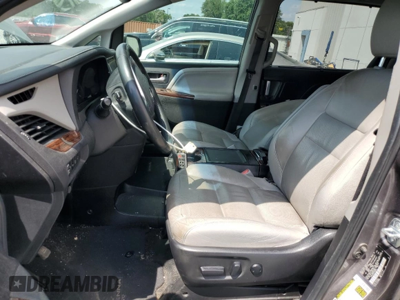 2015 Toyota Sienna XLE with VIN 5TDYK3DC5FS630556, listed as a Copart auction lot 54019705 with 183,421 mi miles and Salvage Title. Bid and sale history available at DreamBid. Image 7.