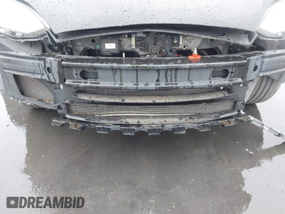 2013 Tesla Model S with VIN 5YJSA1CN0DFP20053, listed as a IAAI auction lot 41470660 with 61,568 mi miles and . Bid and sale history available at DreamBid. Image 6.
