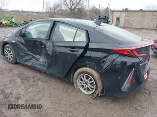 2021 Toyota Prius LE with VIN JTDKAMFP2M3165859, listed as a IAAI auction lot 41943098 with 20,306 mi miles and . Bid and sale history available at DreamBid. Image 3.