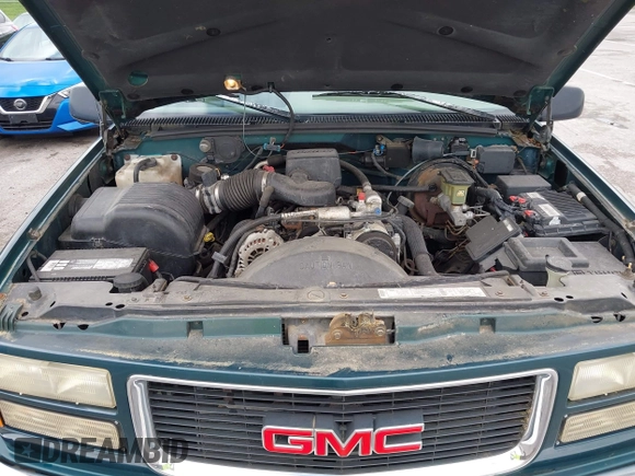 1996 GMC Suburban z VIN 1GKFK16ROTJ725925, wystawiony jako IAAI lot #42244433 z przebiegiem 123 837 mil mil oraz . Historia ofert i sprzedaży dostępna na DreamBid. Obrazek 10.