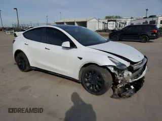 2023 Tesla Model Y Long Range z VIN 7SAYGDEE2PA065048, wystawiony jako Copart lot #48403655 z przebiegiem 56 553 mil mil oraz Szkoda całkowita • Salvage title. Historia ofert i sprzedaży dostępna na DreamBid. Obrazek 4.