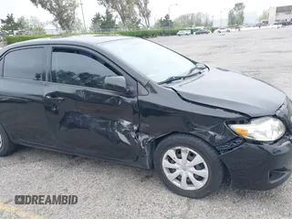 2010 Toyota Corolla with VIN 1NXBU4EE1AZ285449, listed as a IAAI auction lot 42040668 with 121,404 mi miles and . Bid and sale history available at carsss.com. Image 6.