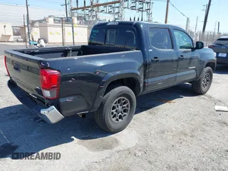 2018 Toyota Tacoma SR5 with VIN 3TMAZ5CN1JM061127, listed as a IAAI auction lot 42012247 with 119,381 mi miles and . Bid and sale history available at DreamBid. Image 4.