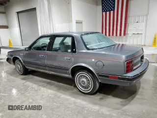 1991 Oldsmobile Cutlass Ciera with VIN 2G3AM54N8M2304905, listed as a Copart auction lot 52047535 with 28,749 mi miles and Salvage Title. Bid and sale history available at DreamBid. Image 2.