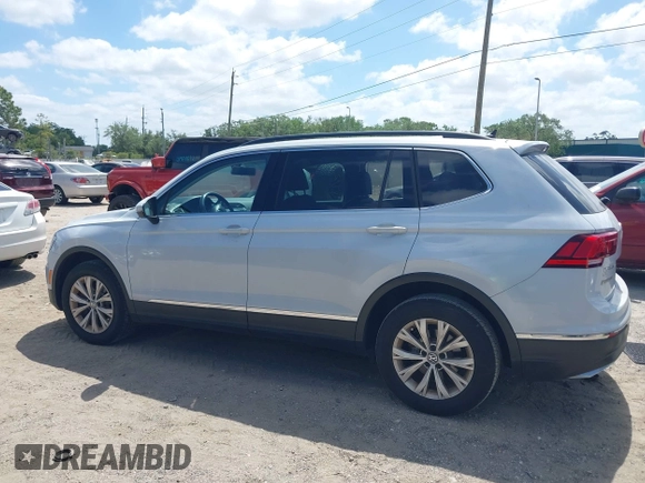 2018 Volkswagen Tiguan SEL with VIN 3VV3B7AX5JM053045, listed as a IAAI auction lot 41963017 with 77,495 mi miles and . Bid and sale history available at DreamBid. Image 14.
