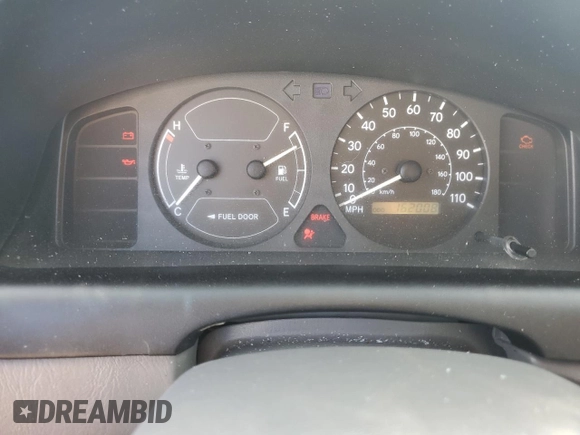 2000 Toyota Corolla VE with VIN 1NXBR12E5YZ387383, listed as a Copart auction lot 78931374 with 162,008 mi miles and Salvage title. Bid and sale history available at DreamBid. Image 9.