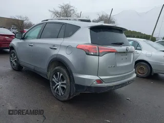 2018 Toyota RAV4 LE with VIN 2T3BFREVXJW717079, listed as a IAAI auction lot 42001580 with 96,044 mi miles. Bid and sale history available at carsss.com. Image 3.
