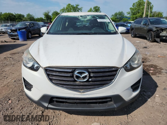 2016 Mazda CX-5 Sport with VIN JM3KE4BYXG0704194, listed as a Copart auction lot 62095735 with 93,970 mi miles and Salvage title. Bid and sale history available at DreamBid. Image 5.