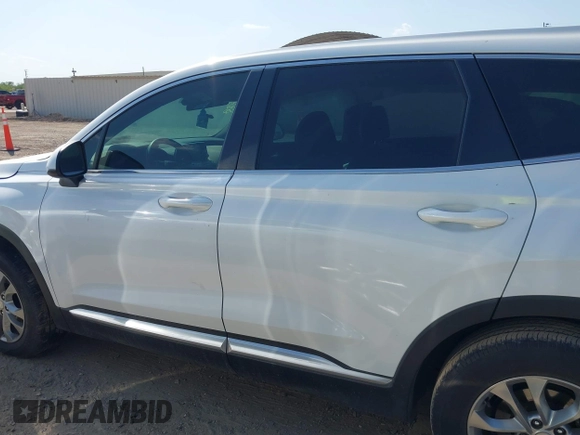 2019 Hyundai Santa Fe SE with VIN 5NMS23AD8KH051223, listed as a IAAI auction lot 42017754 with 146,704 mi miles and . Bid and sale history available at DreamBid. Image 13.