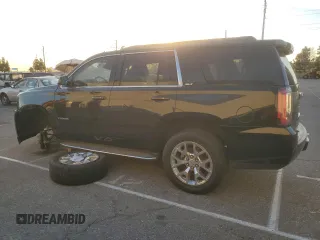 2015 GMC Yukon SLT with VIN 1GKS1BKC9FR144289, listed as a Copart auction lot 42179675 with 122,807 mi miles and Salvage Title. Bid and sale history available at carsss.com. Image 2.