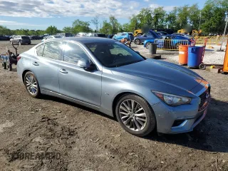 2018 Infiniti Q50 Luxe with VIN JN1EV7APXJM590569, listed as a Copart auction lot 55643215 with 86,965 mi miles and Salvage title. Bid and sale history available at DreamBid. Image 4.
